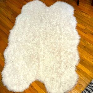 White fuzzy faux shearling rug